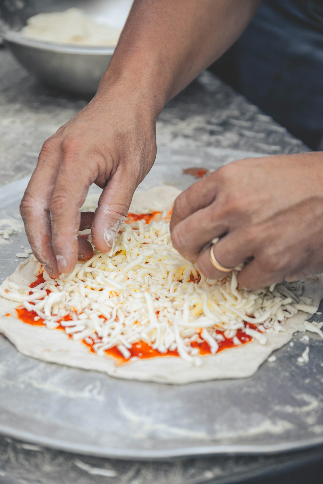 Pizza dough being stretched